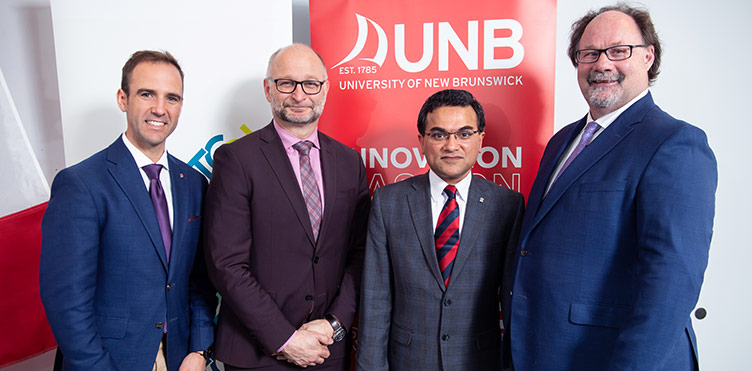 Then-Fredericton MP Matt DeCourcey, Minister of Justice and Attorney General David Lametti, Dr. Gobinda Saha and Dr. David MaGee. Credit: Rob Blanchard/UNB