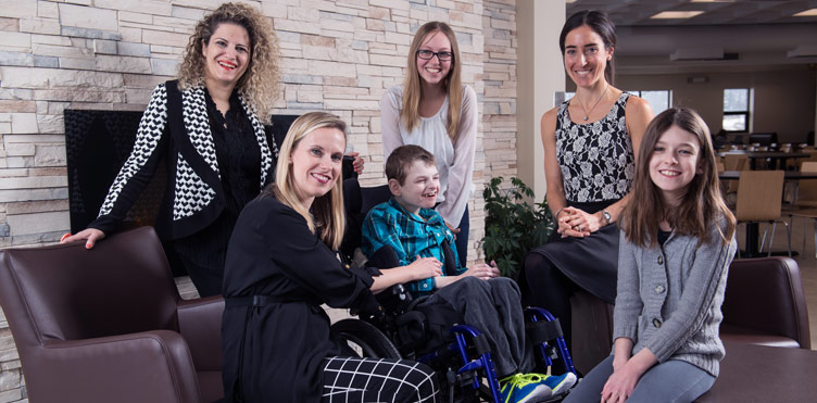 Back from left, Dr. Rima Azar, associate professor of health psychology at Mount Allison; Kennedy Fiander; Dr. Shelley Doucet, Jarislowsky Chair in Interprofessional Patient-Centered Care at UNB Saint John. Front from left, Jennifer Belyea, seated next to her son with complex health needs, Cameron Fiander and daughter Peyton Fiander.