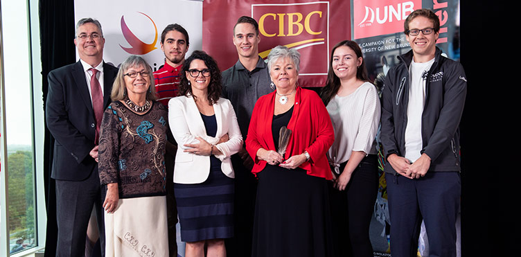 (L-R): Eddy Campbell, President and Vice-Chancellor, UNB; Imelda Perley (Opolahsomawehs), Elder-in-Residence, UNB; Tyrone Baker-Perley, CIBC – University of New Brunswick Indigenous Bursary recipient; Alicia Dubois, Market Vice-President, Indigenous Markets, CIBC; Rylan Parenteau, CIBC – University of New Brunswick Indigenous Bursary recipient; Roberta Jamieson, President and CEO, Indspire; Desiree Isaac-Pictou, CIBC – University of New Brunswick Indigenous Bursary recipient; Matthew LeBlanc, CIBC – University of New Brunswick Indigenous Bursary recipient.