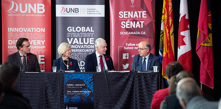 From left to right, Sen. Percy Mockler, Sen. Carolyn Stewart Olsen, Sen. Douglas Black, and Dr. Ali Ghorbani, director of the Canadian Institute for Cybersecurity at the University of New Brunswick. Credit: Rob Blanchard/UNB