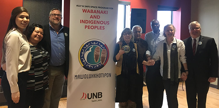Amanda Rogers, Piluwitahasuwin (AVP Indigenous Engagement); Shelley Francis, Director, NUTSIHPILUWEWICIK; Dan Nagel, faculty of nursing; Elder Imelda Perley, Elder-in-Residence; David Perley, Director, Mi'kmaq-Wolastoqey Centre; Chola Shamputa, faculty of nursing; Catherine Hamilton, faculty of nursing; Dr. Robert McKinnon, former Vice-President Saint John. Credit: UNB