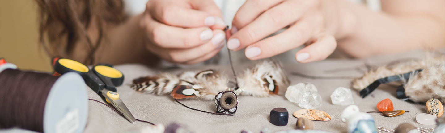 Young teen making jewelry