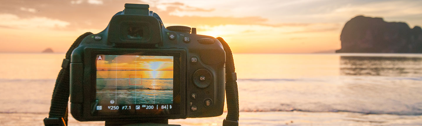 Photo: SLR camera on the beach