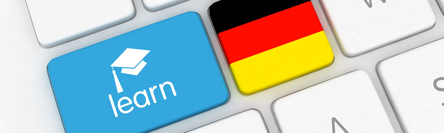 A keyboard with a button that says "learn" and another that's the German flag