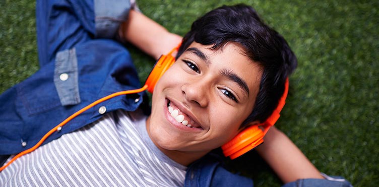 Happy young person with headphones on