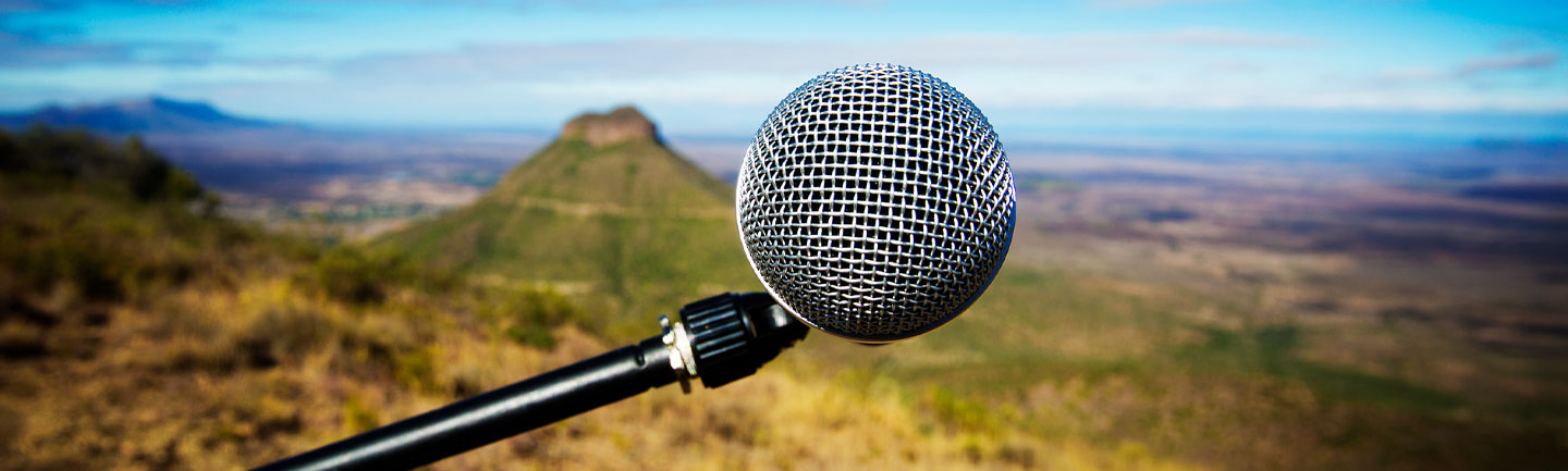 A microphone in front of a landscape