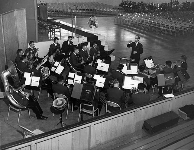 Douglas Start conducting the UNB Band at the 1963 Encaenia at the Lady Beaverbrook Rink. Courtesy of UNB Archives, UA PC 16(1) No.1a