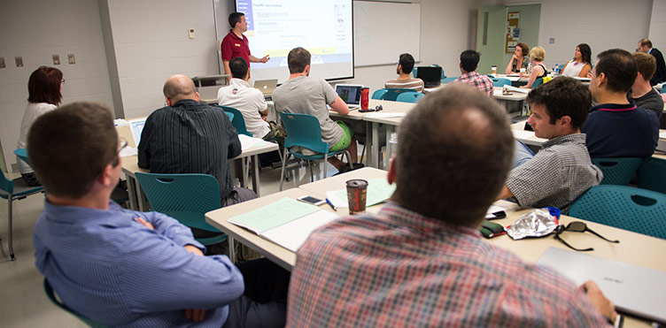 A photo of a CETL staff member instructing a group of individuals on teaching methods.