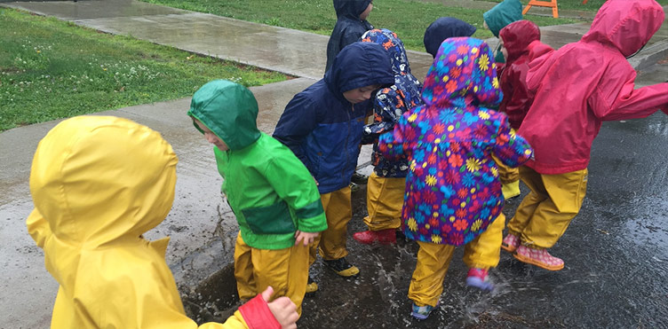 Children playing in the rain