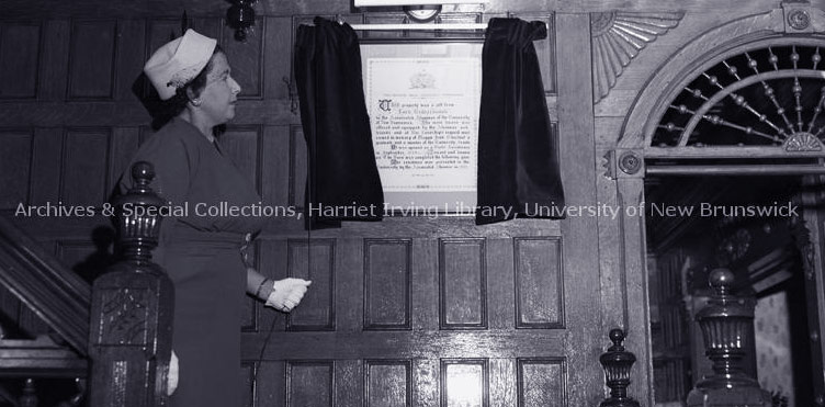 Muriel Farris Baird unveiling the illuminated scroll at Maggie Jean Chestnut Residence, Oct. 1957.