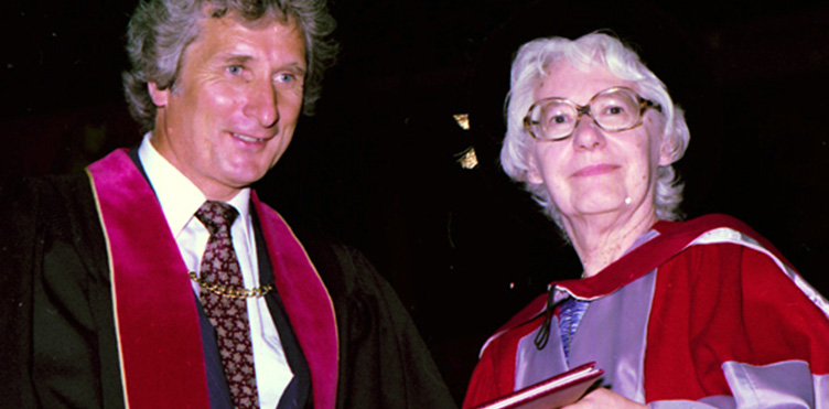 Elizabeth Brewster receives her honourary doctorate in 1982 from UNB President Dr. James Downey