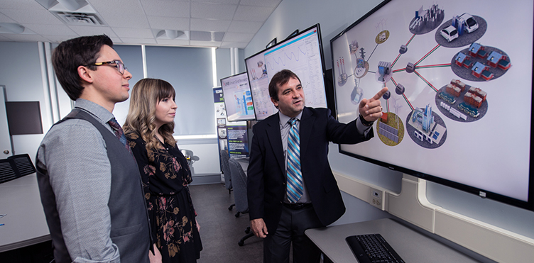 UNB students Xavier St. Onge, Katie ​McDonald with faculty member Eduardo Castillo are a part of the Emera & NB Power Research Centre for Smart Grid Technologies