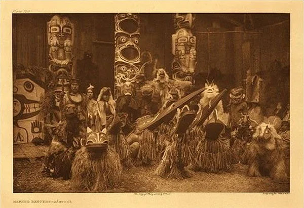 Showing of masks at Kwakwaka'wakw potlatch. From The New World Encyclopedia: https://www.newworldencyclopedia.org/entry/Kwakwaka%27wakw