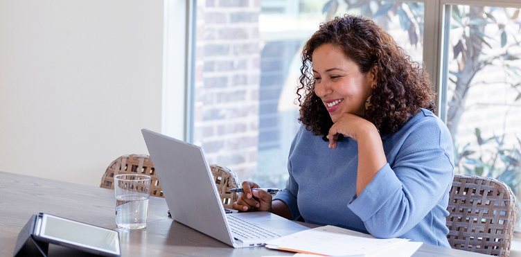 photo of woman at a laptop