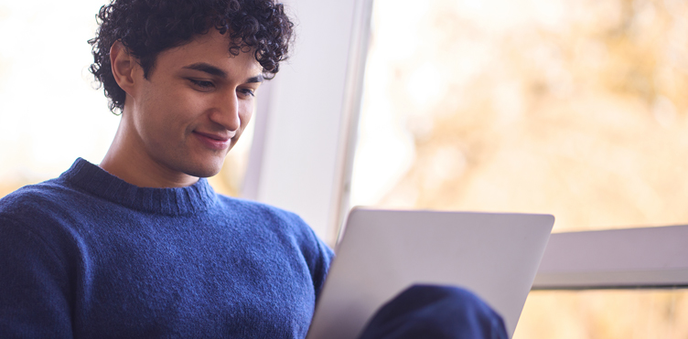 photo of man with a laptop