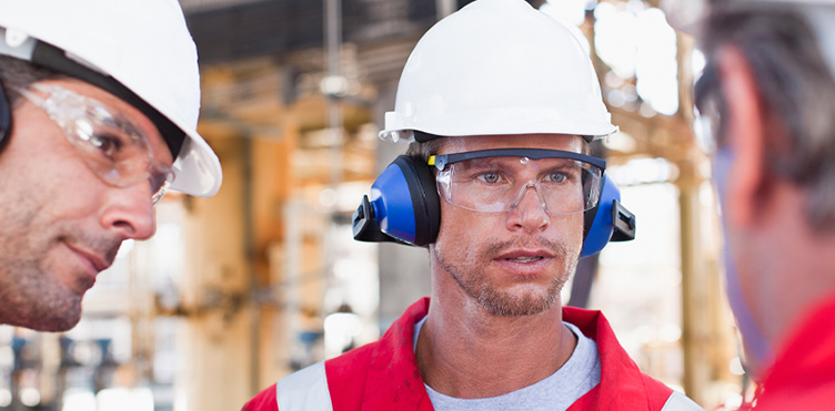 Workers wear safety eyewear