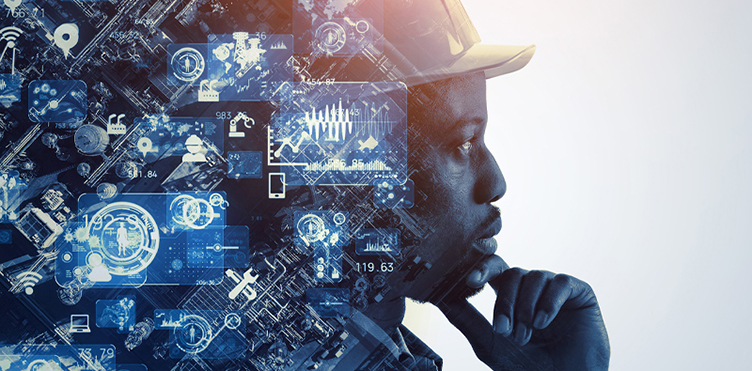 Person in a hard hat overlaid with digital data graphics, symbolizing systems thinking in workplace safety.