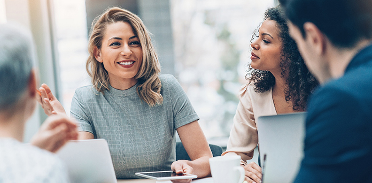 Photo of professionals talking during a n a meeting