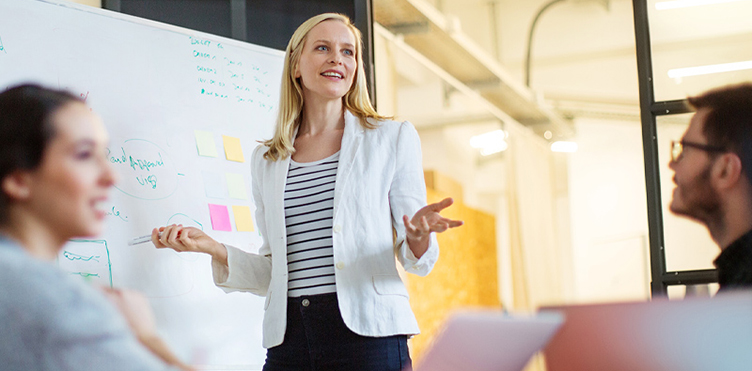 Photo of a professional leading a team meeting