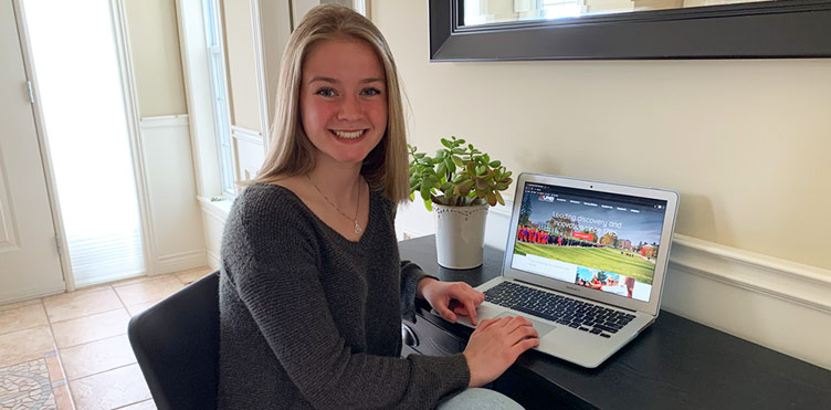 Female student at home with a laptop