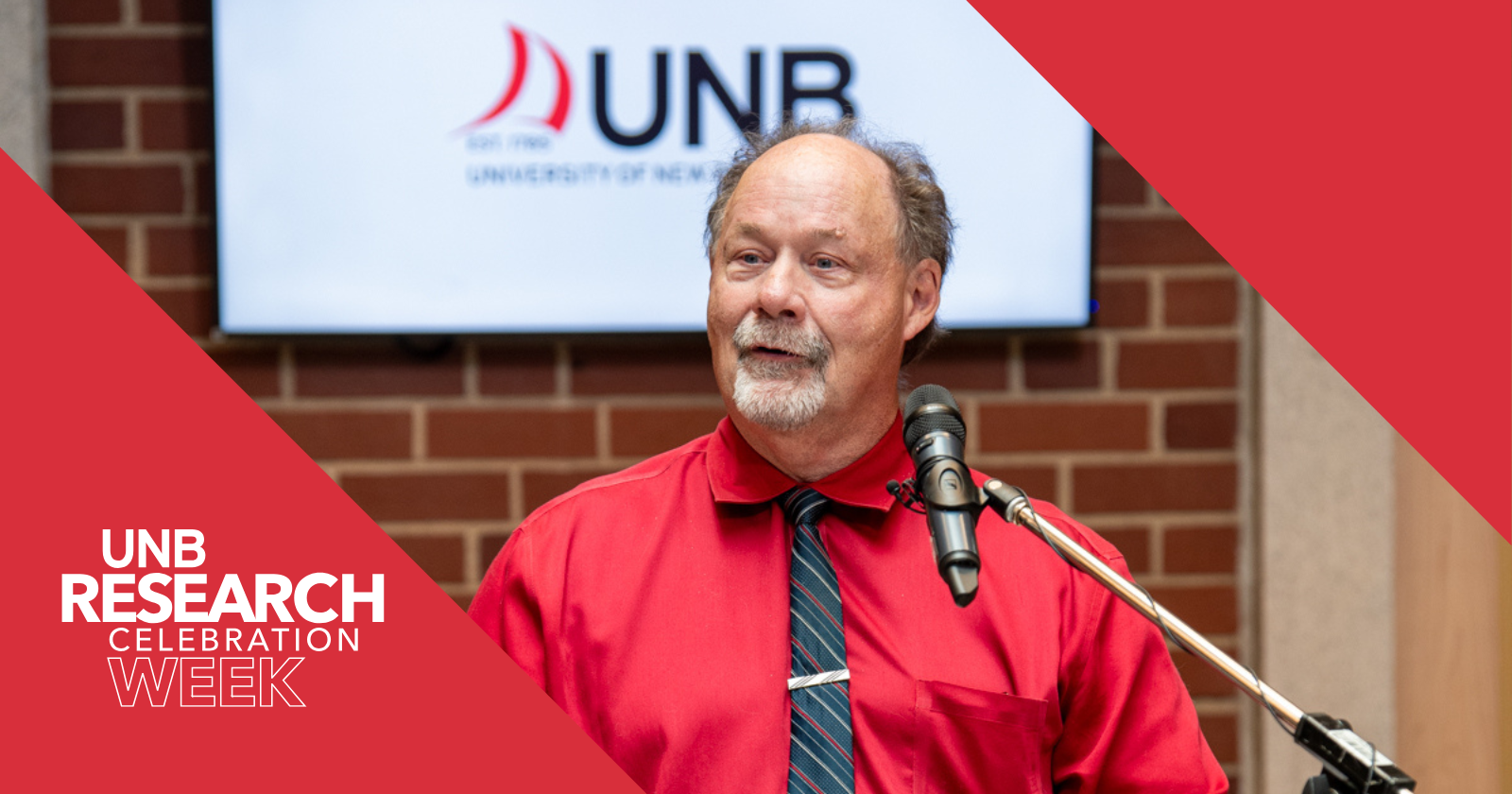 a photo of Dr. Dave MaGee, VP research, speaking at a podium