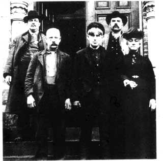 George Gee on Steps of Woodstock Jail, 1904 Left to right: Sheriff Foster, Benjamin Gee, George Gee, Chief of Police Owen Kelly, Zora Gee. Credit: Carleton Sentinel, April 29, 1904